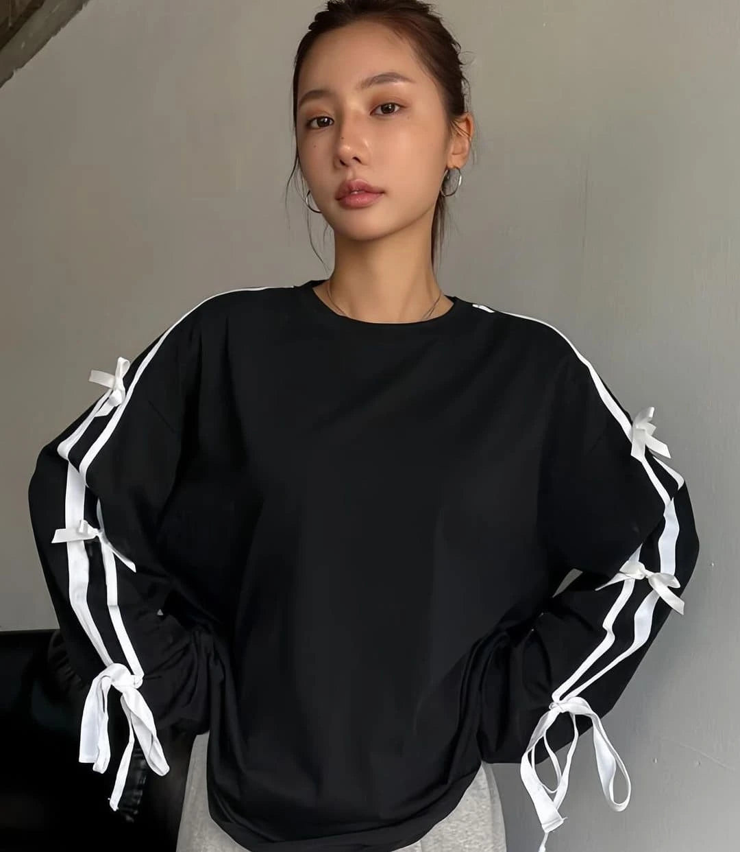 بدي نسائي اسود باشرطة فيونكة