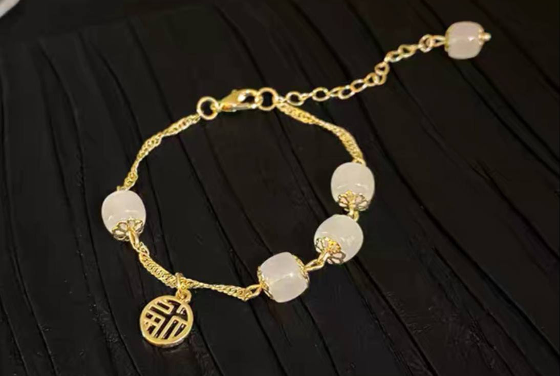 سوار نسائي ذهبي حجر ابيض