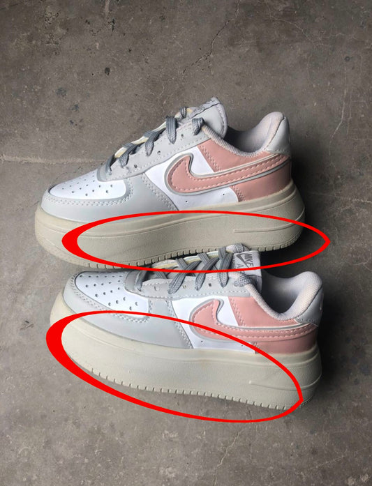 حذاء نايك رصاصي ووردي معيوب , صفار اسفل الحذاء